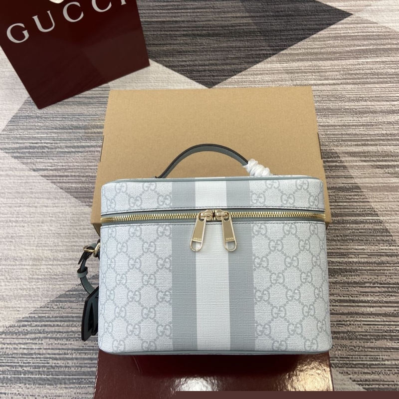 G*u*i cosmetic bags